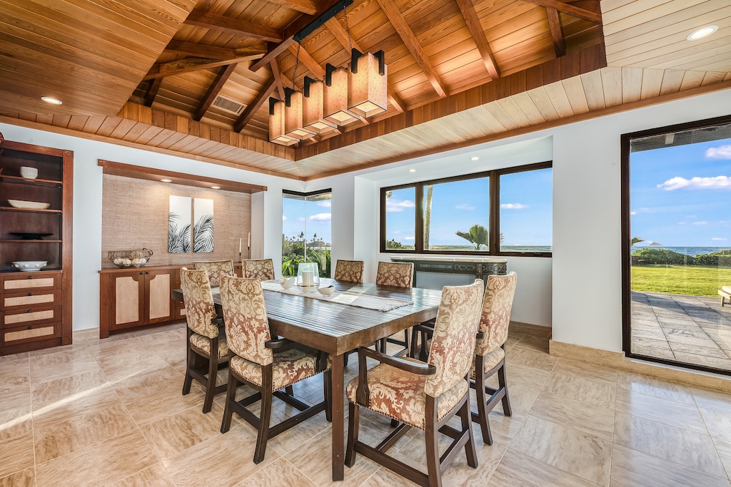 Dine and lounge indoors or out—the living space flows effortlessly to extensive lanais.