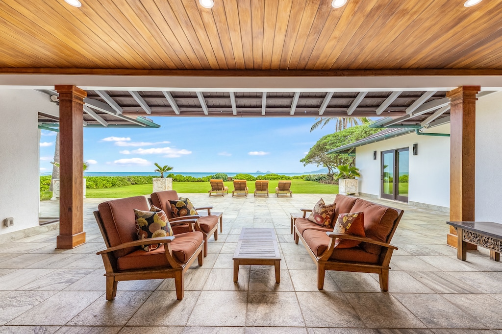 Retreat to luxury on the covered lanai overlooking Kailua Bay and the iconic Mokulua Islands.