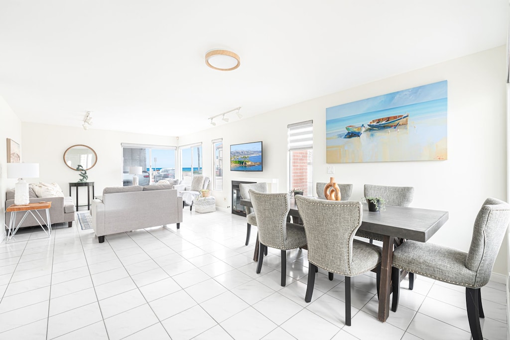 Open-concept living and dining areas on the ground floor showcase ocean views