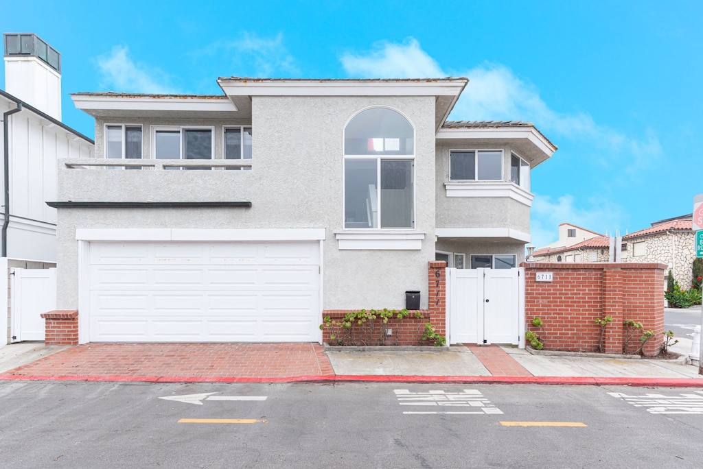 Experience the full charm of this two-story coastal retreat in Newport Beach