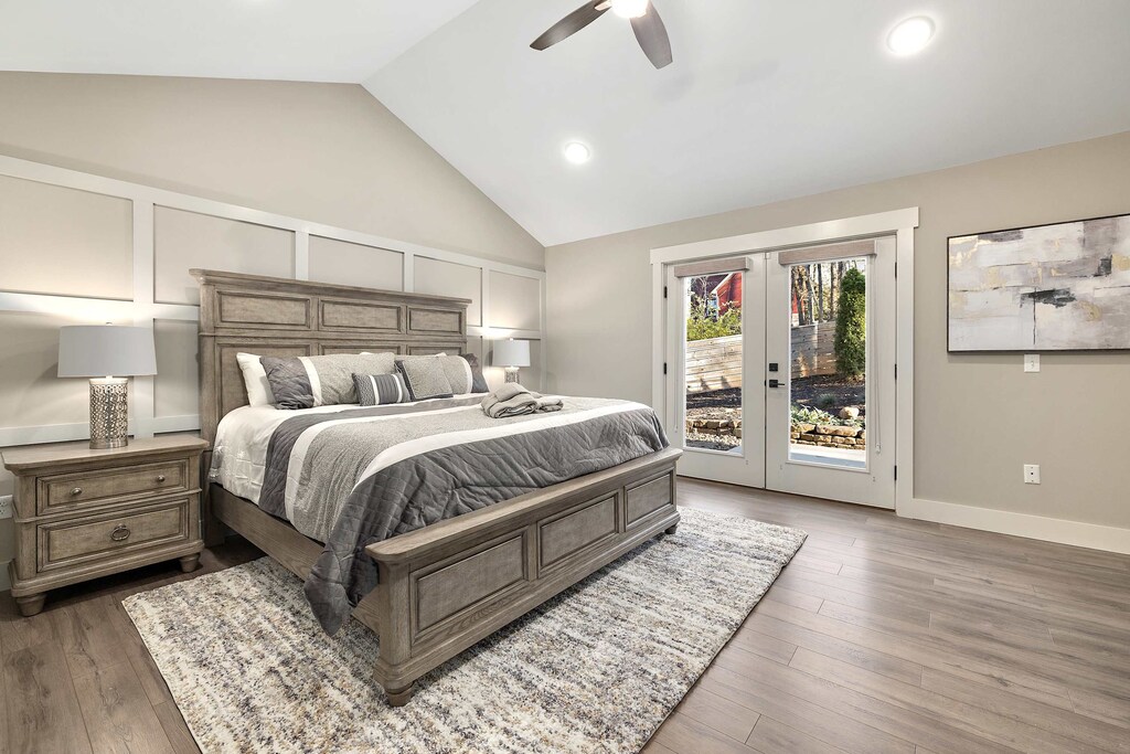 Our Master bedroom is complete with a King-size bed, walk-in closet, dresser, 44" Smart TV, en suite bath and direct access to the back patio.