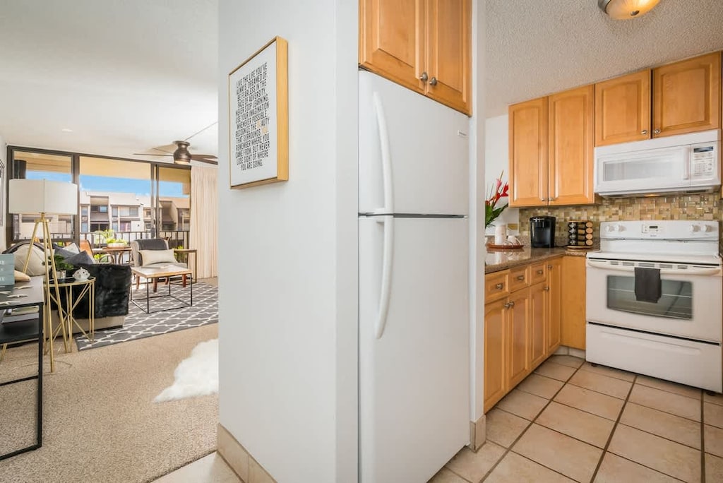 Enjoy the convenience of a fully equipped kitchen leading into a bright, comfortable living area.