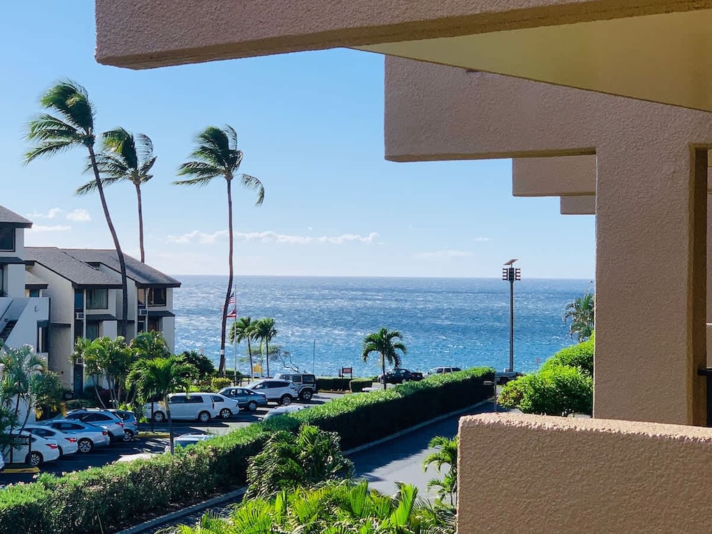 Savor your morning coffee on our sunny balcony with stunning resort views.