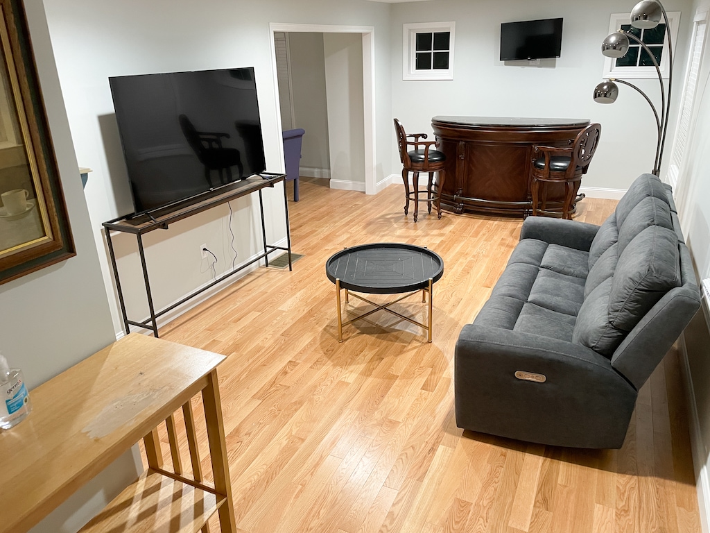 Step into a stylish and inviting living room, complete with a cool, built-in bar.