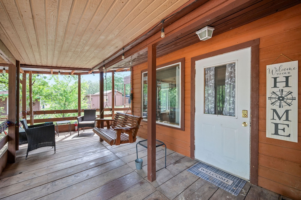 Tiny Town The Kid Cabin 1 Lovely wrap around porch and swing