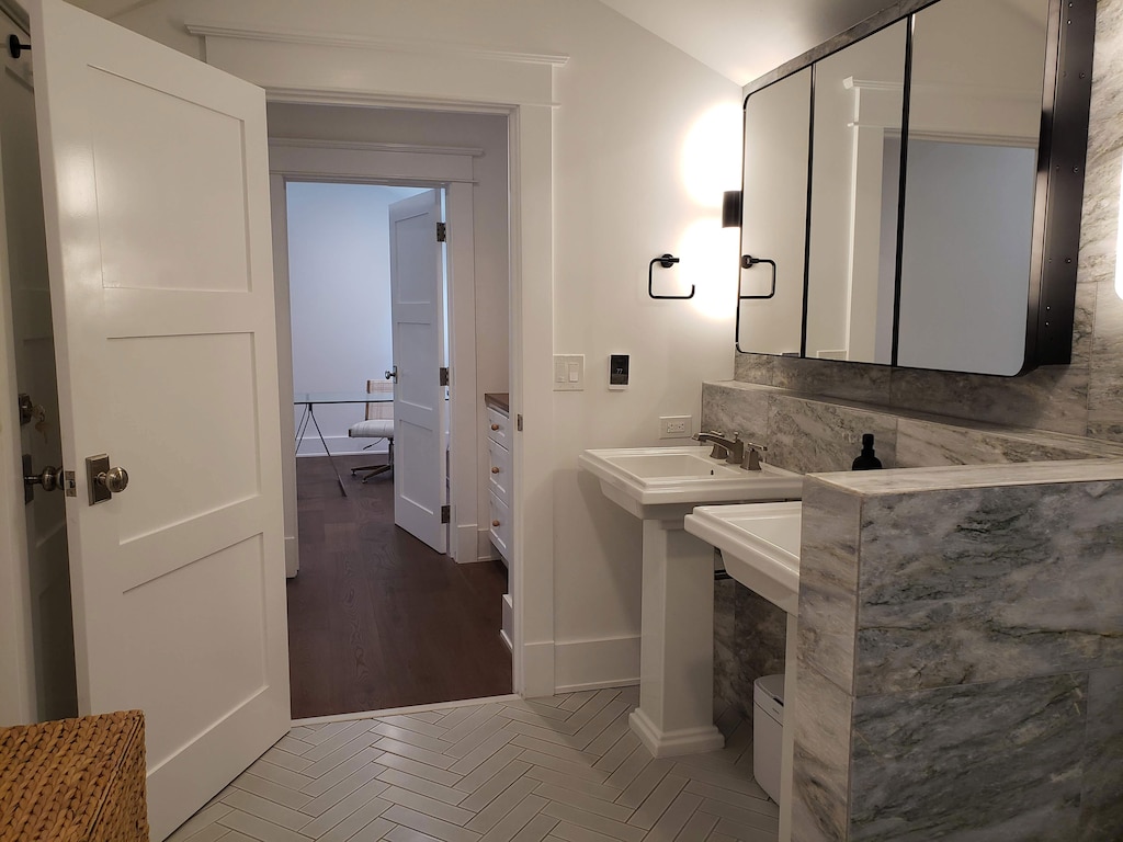 Double vanities, marble and tile accents, in floor heat - you'll wish you could take the bathroom home with you at checkout!