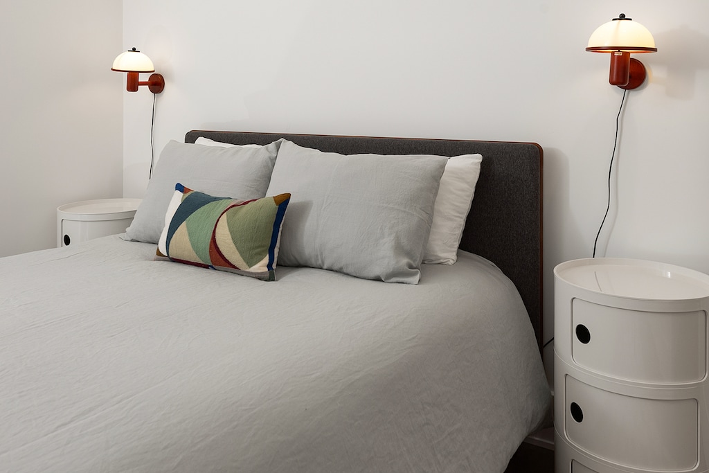 The Queen bed in downstairs bedroom is steps from a full bathroom.