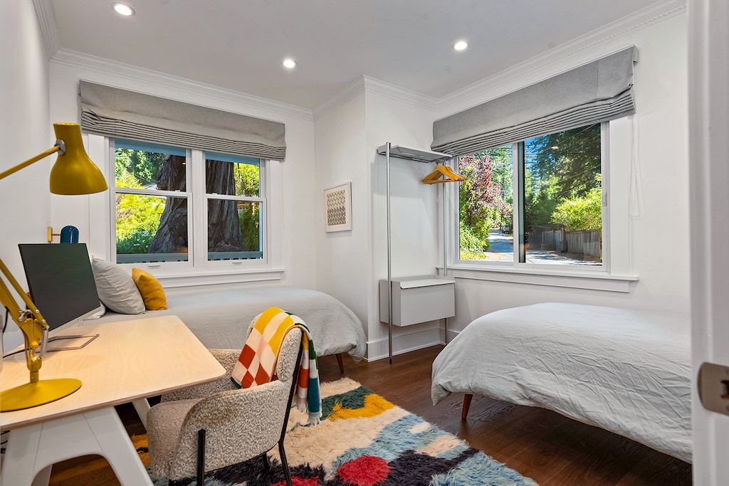 Two Twin beds in the front bedroom with a laptop-ready desk.