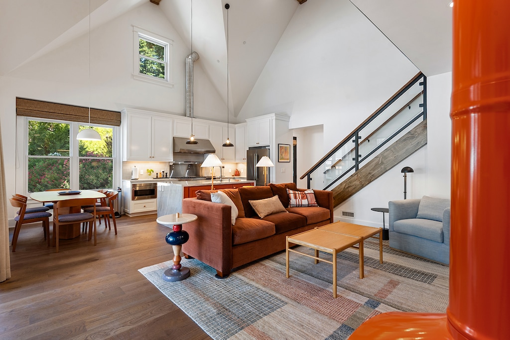 The open concept kitchen, dining and living room