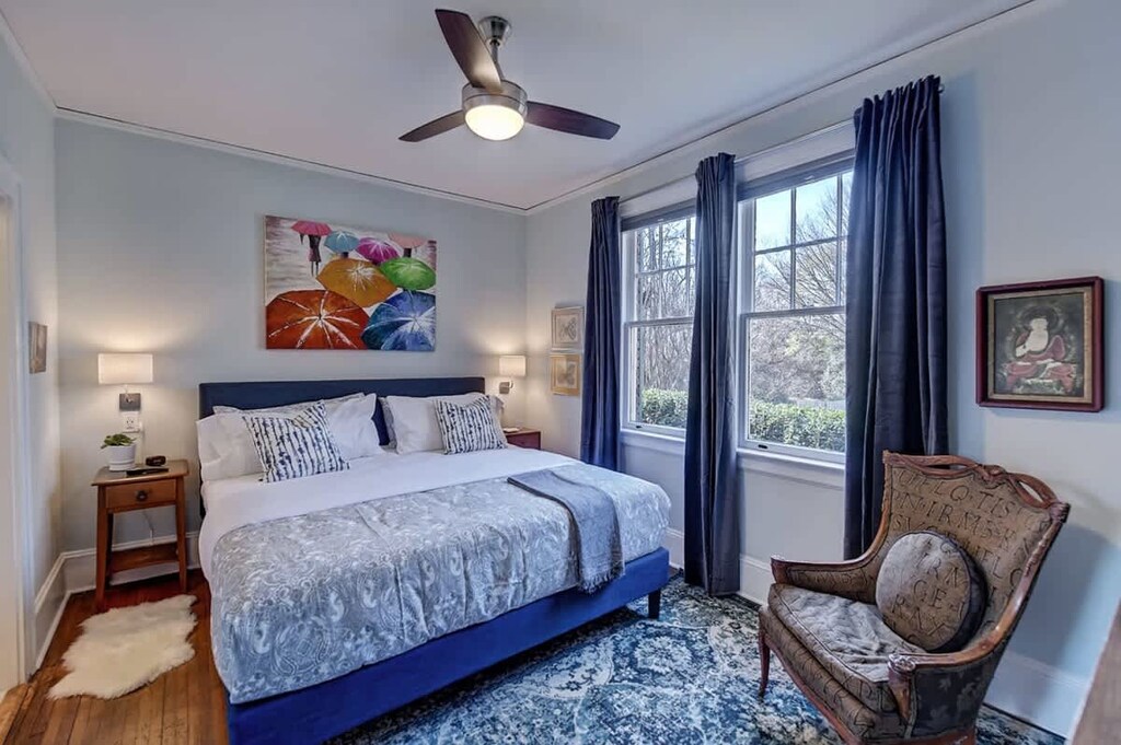 Sophisticated calming bedroom with nice windows