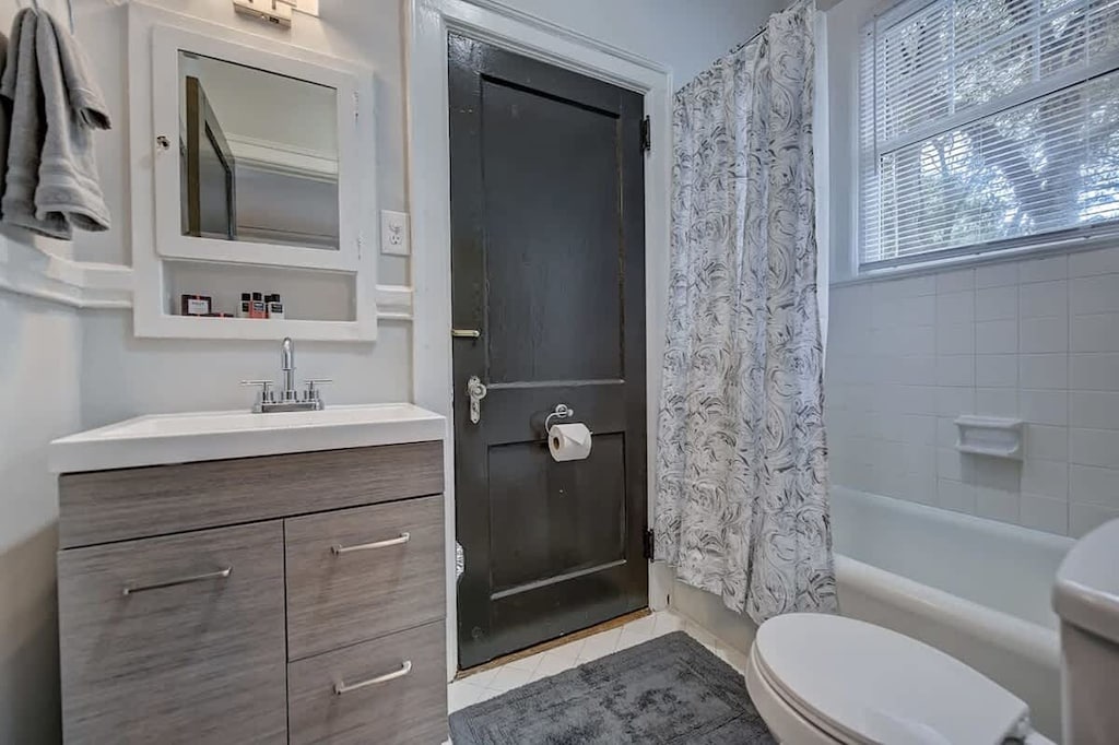 Rustic themed bathroom with vanity and bathtub