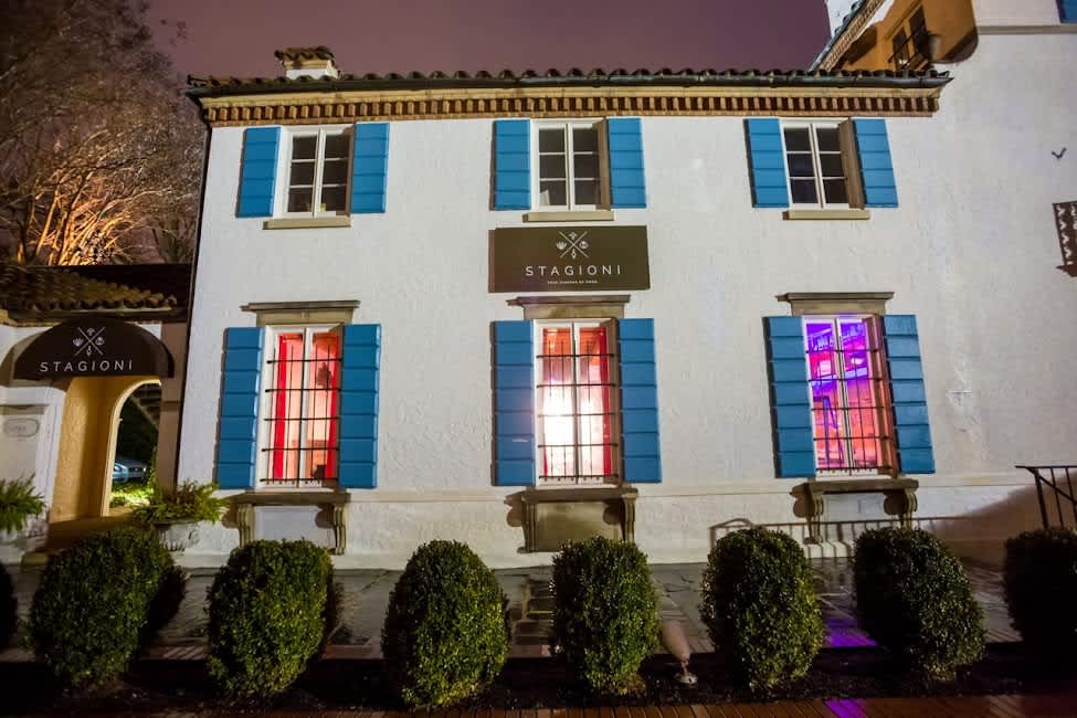 Enjoy a glass of fine wine on a breezy patio as the sun sets over the beautiful city streets.