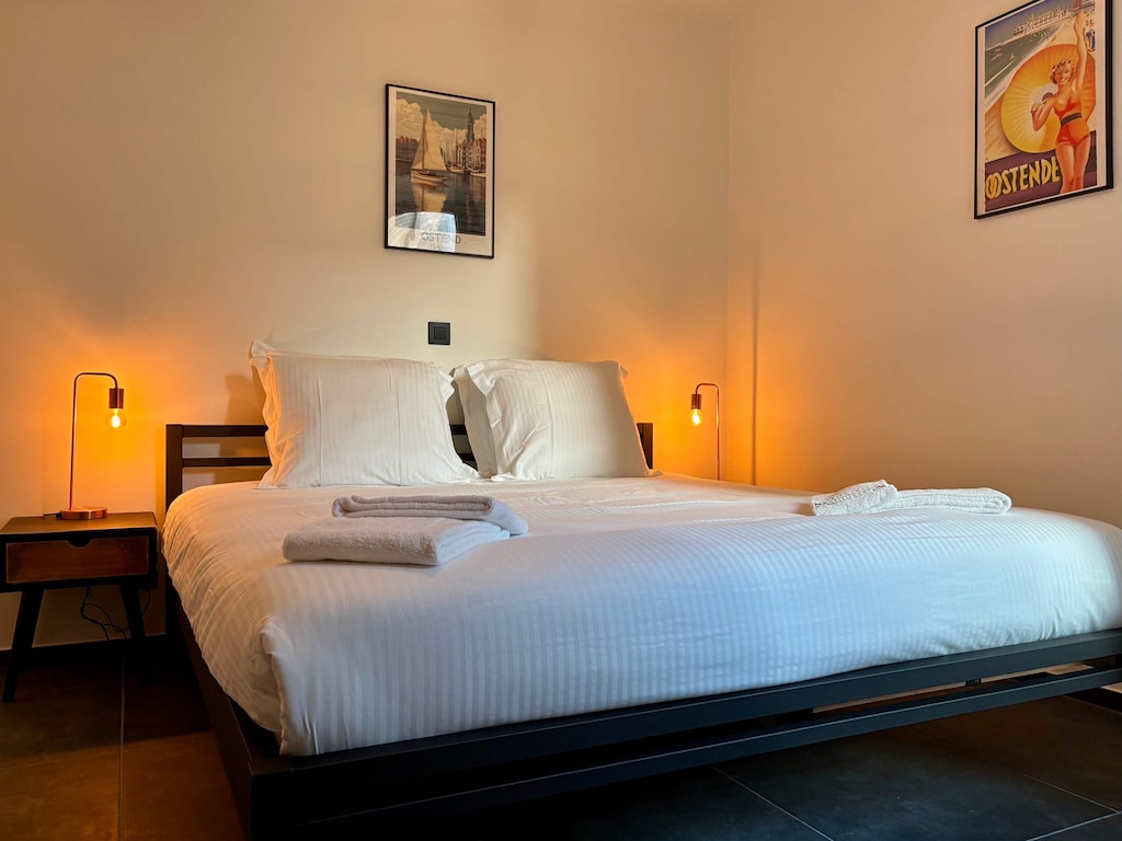 Softly lit bedroom with crisp linens for a peaceful night’s sleep