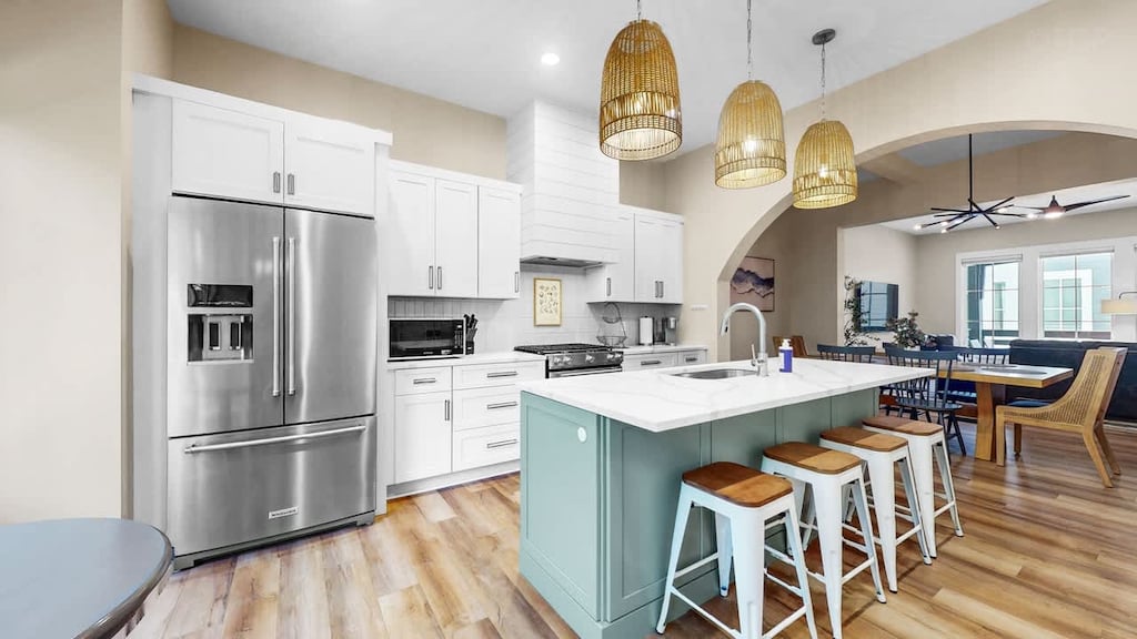 Gorgeous brand-new kitchen with seating for 6. A dining table is located in next room with seating for 6 as well