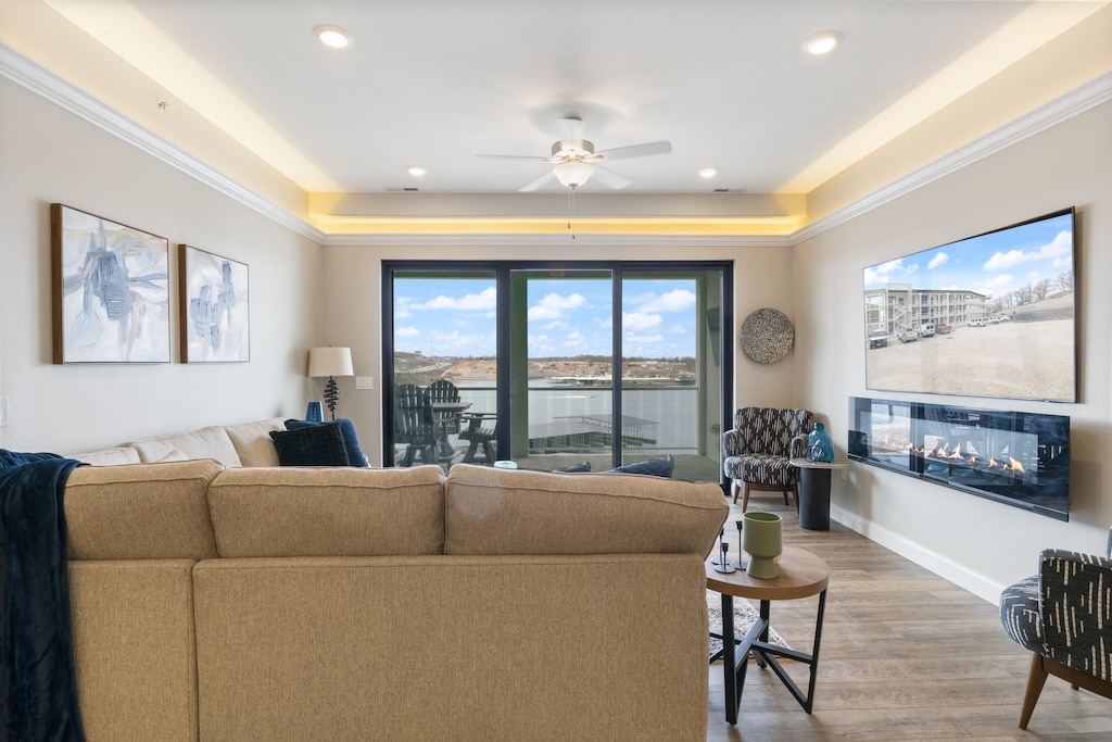 The main living area creates a warm space with fireplace and wall of window lake views.