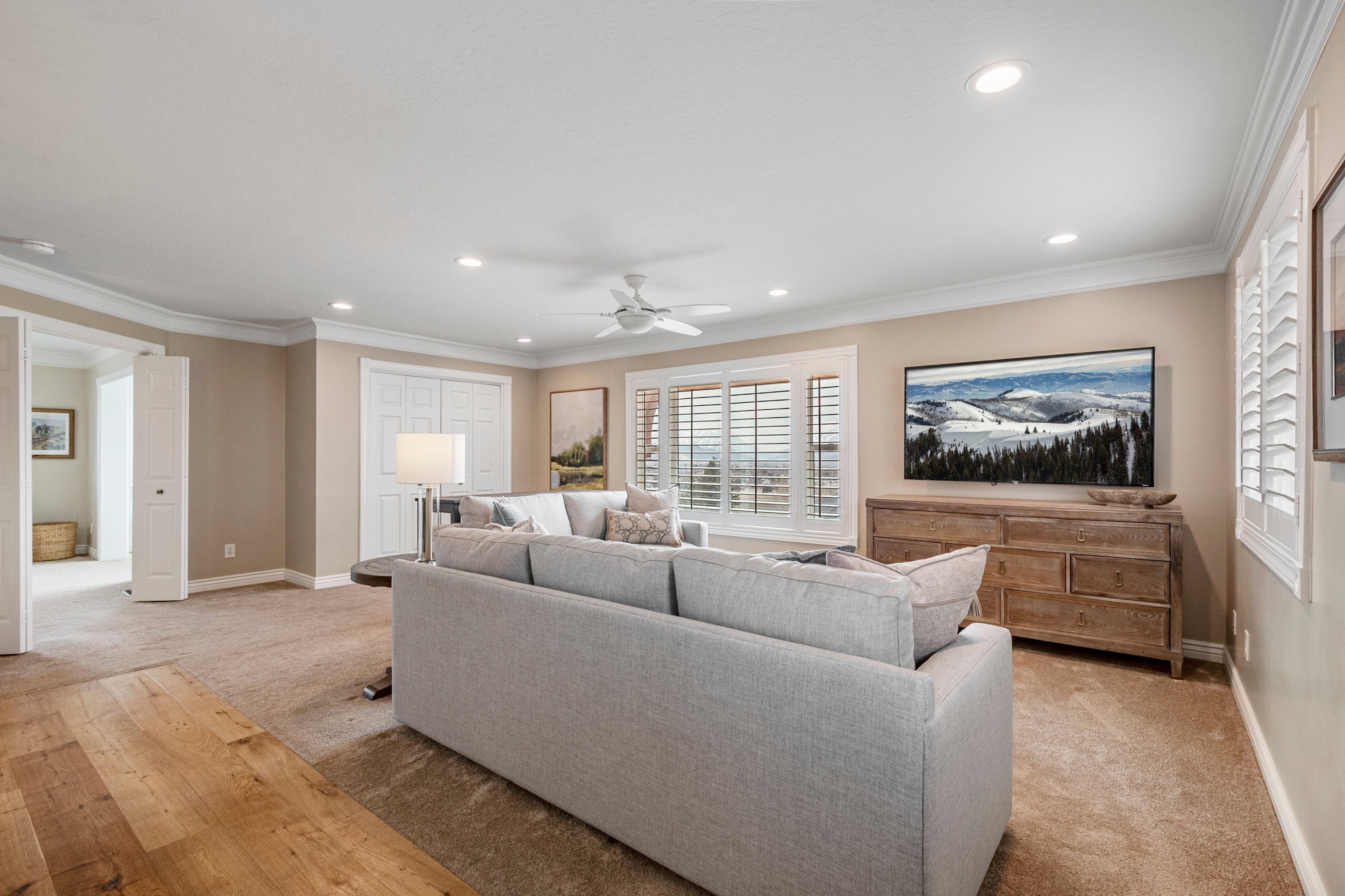 A super comfy couch, ottomans, Smart TV and sleeper sofa in the main floor great room