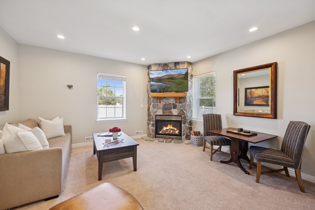 Charming and spacious living room and family room areas with plenty of seating and an indoor fireplace.  Perfect for family & friends gatherings!