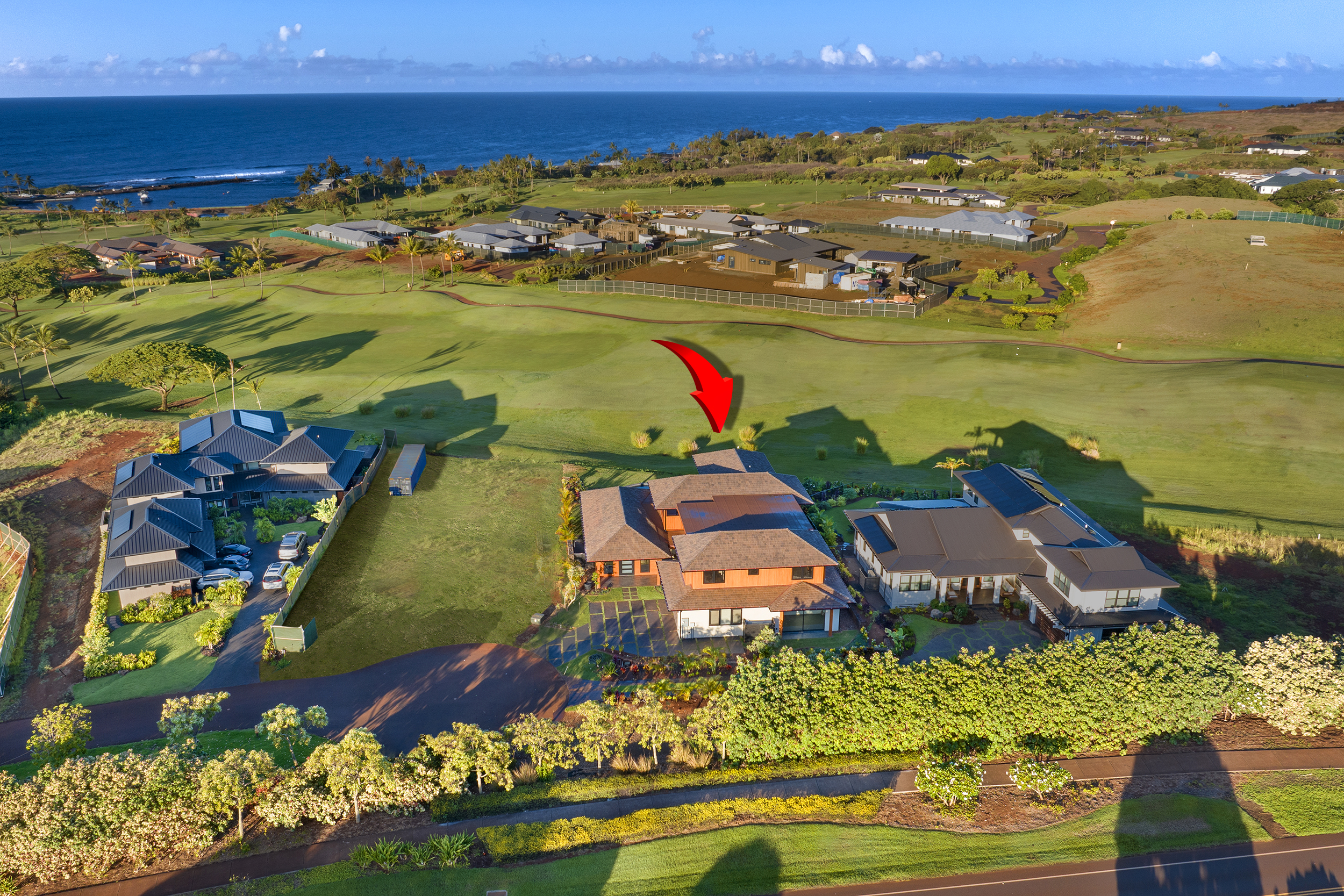 Aerial view showing the home’s oceanfront position along the fairway.
