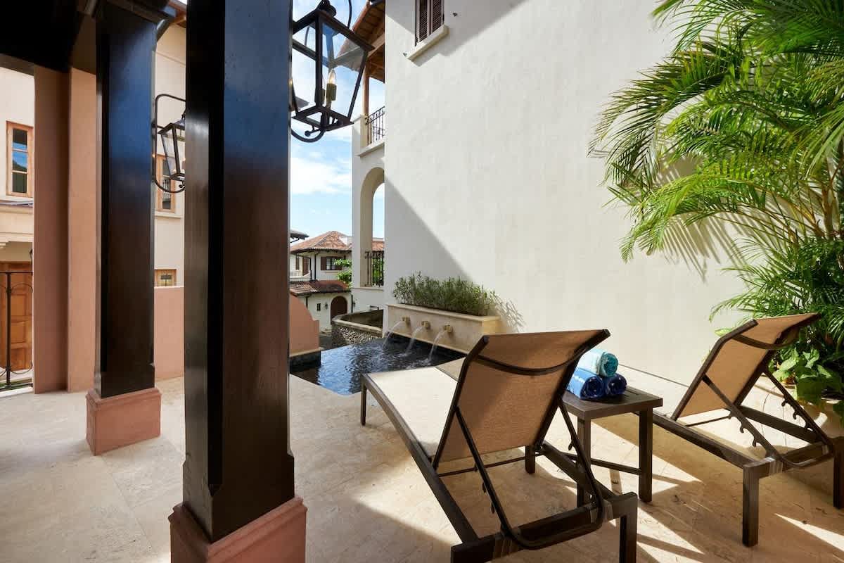Pool area with comfortable lounge chairs.