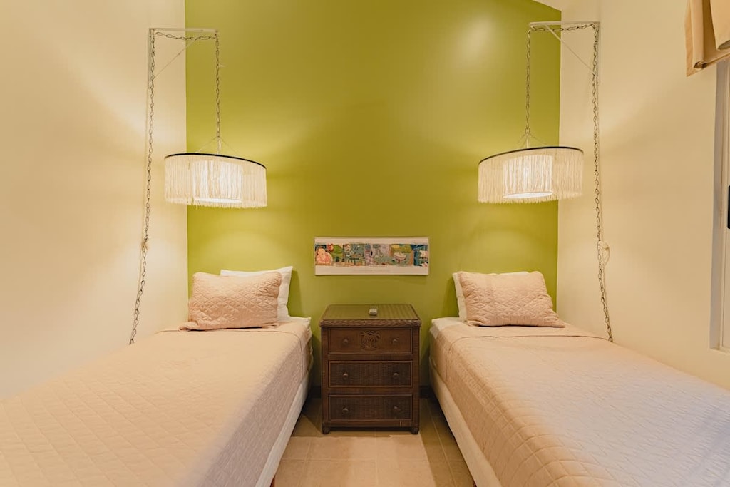 First guest bedroom, two single beds.