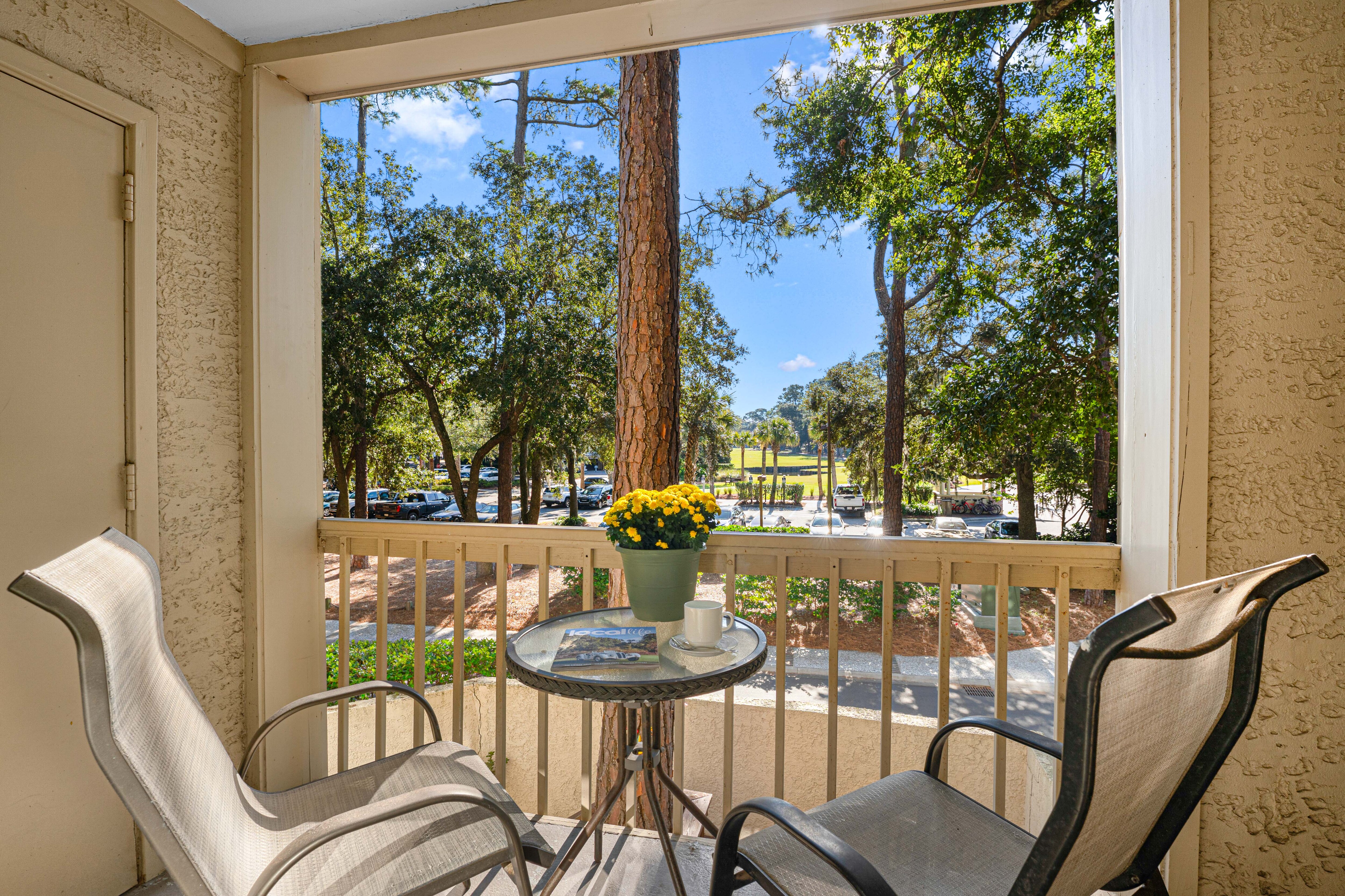 Private balcony overlooking the peaceful wooded surroundings, as well as the first tee box