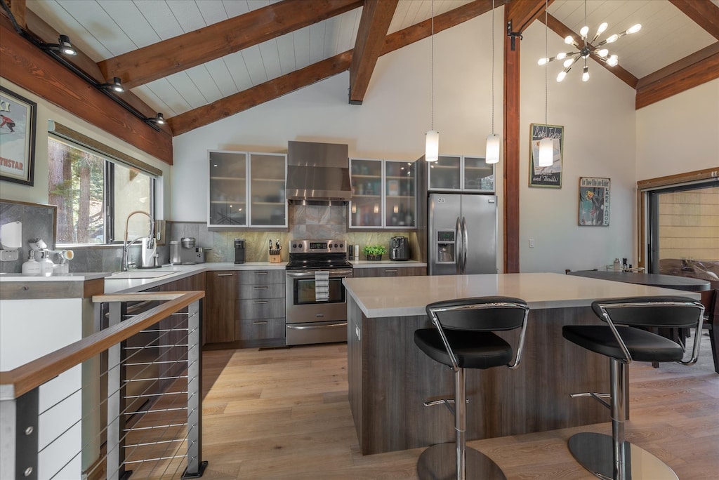 Sleek and stylish: This open-concept kitchen boasts modern renovations, featuring top-end appliances and high-quality cookware, perfect for culinary enthusiasts.