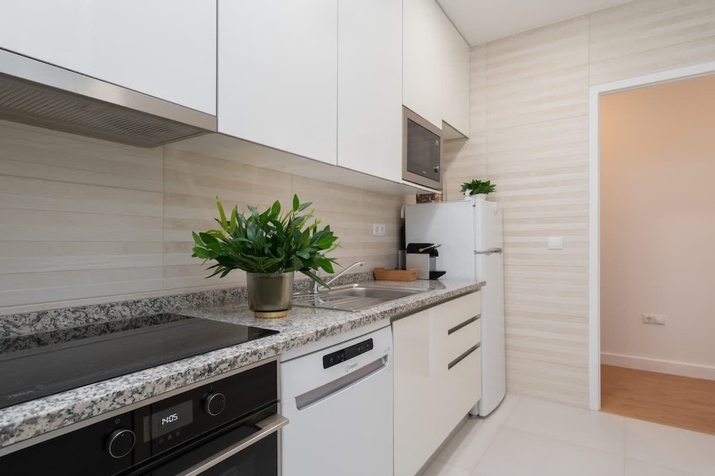 The kitchen is fully equipped to cook the delicious dishes in a comfy space. 
