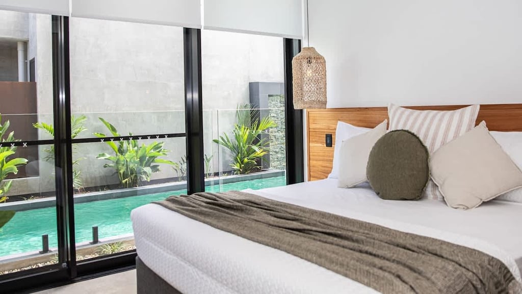 Azure Port Douglas - Downstairs bedroom overlooking the pool