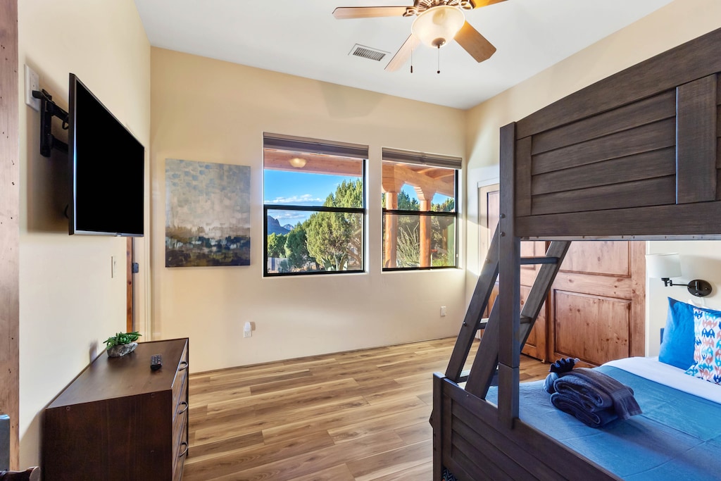 Bunk room with a smart TV