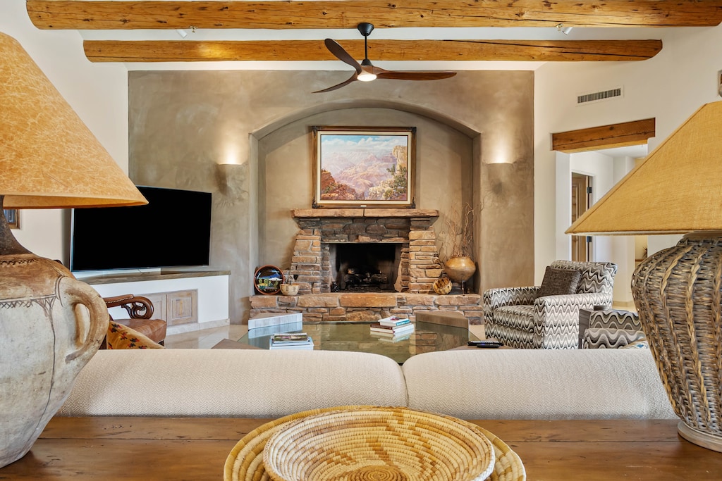 Main Living Room with Comfortable Seating, Fireplace, and Smart TV