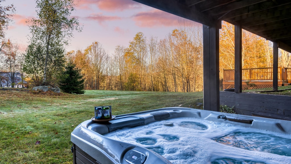 Unwind in the hot tub while taking in the views of the lush surroundings.