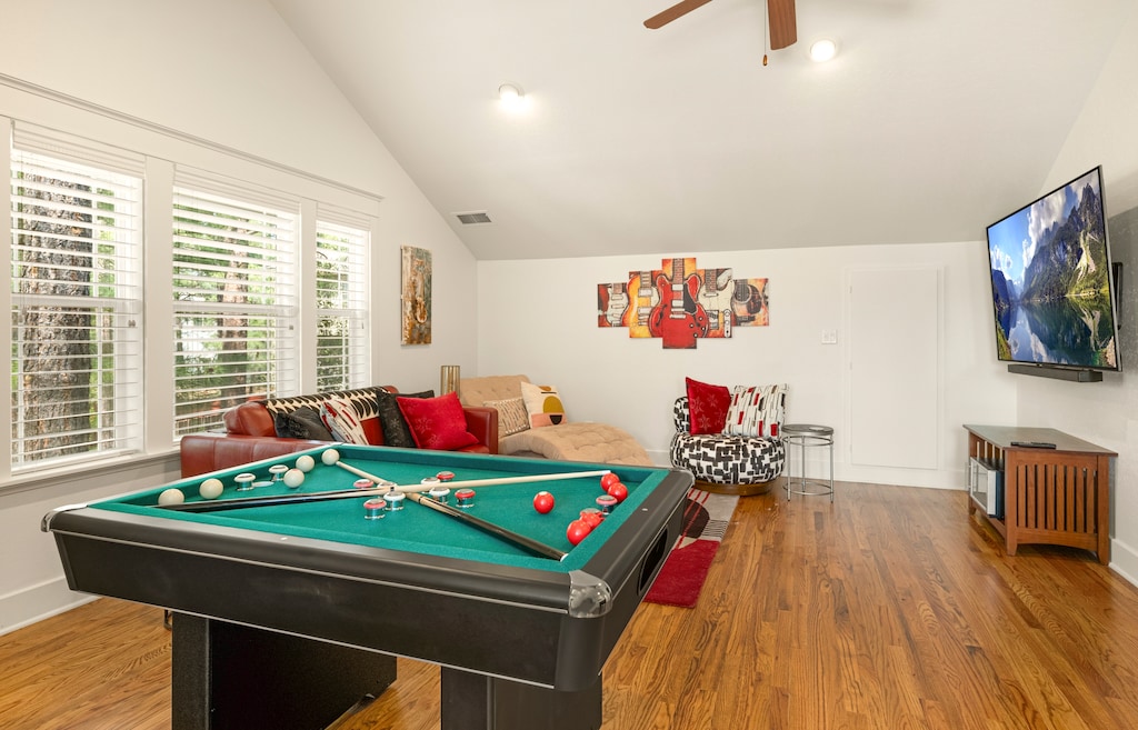 A phenomenal game room with a pool table and arcades