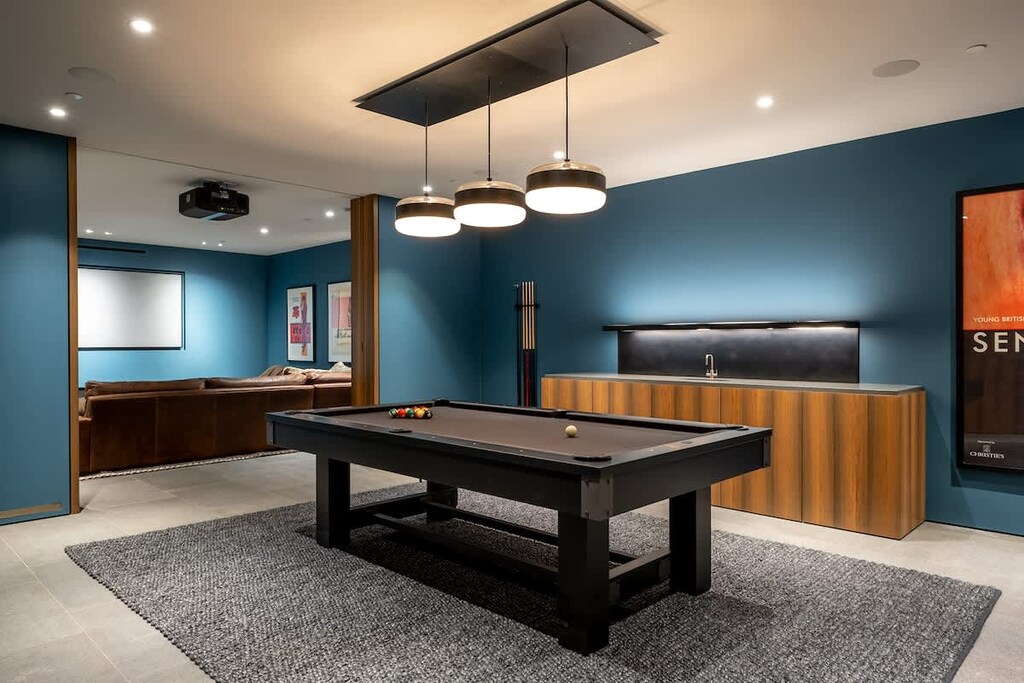 - Entertainment room featuring a stylish pool table  
- Modern lighting and cinematic setup for fun-filled nights  
- Perfect hangout spot after a day on the slopes  