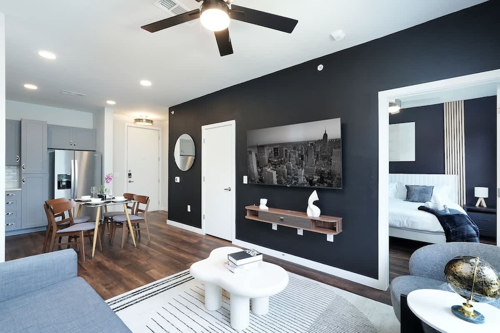 Relax in our living room, with cozy chairs, a comfy sofa, and artistic accents that make it truly unique.