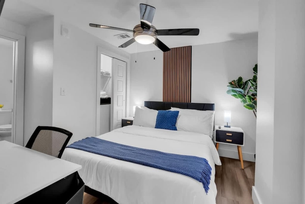 Spacious bedroom featuring a convenient workstation.