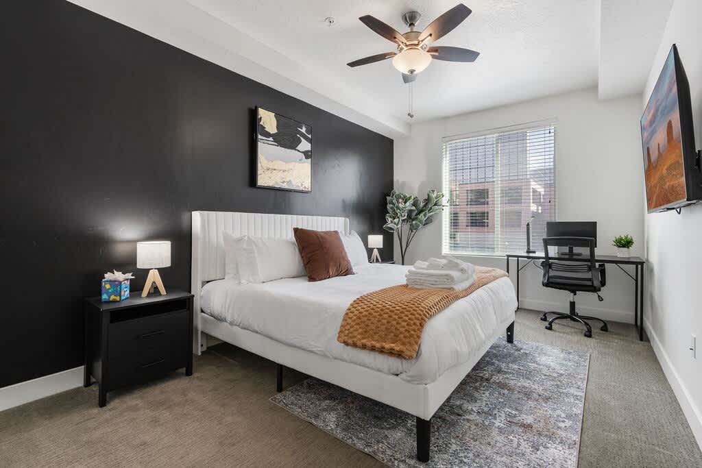 Wake up to picturesque views from our cozy bedroom, complete with a king bed, TV, and a thoughtfully placed plant.