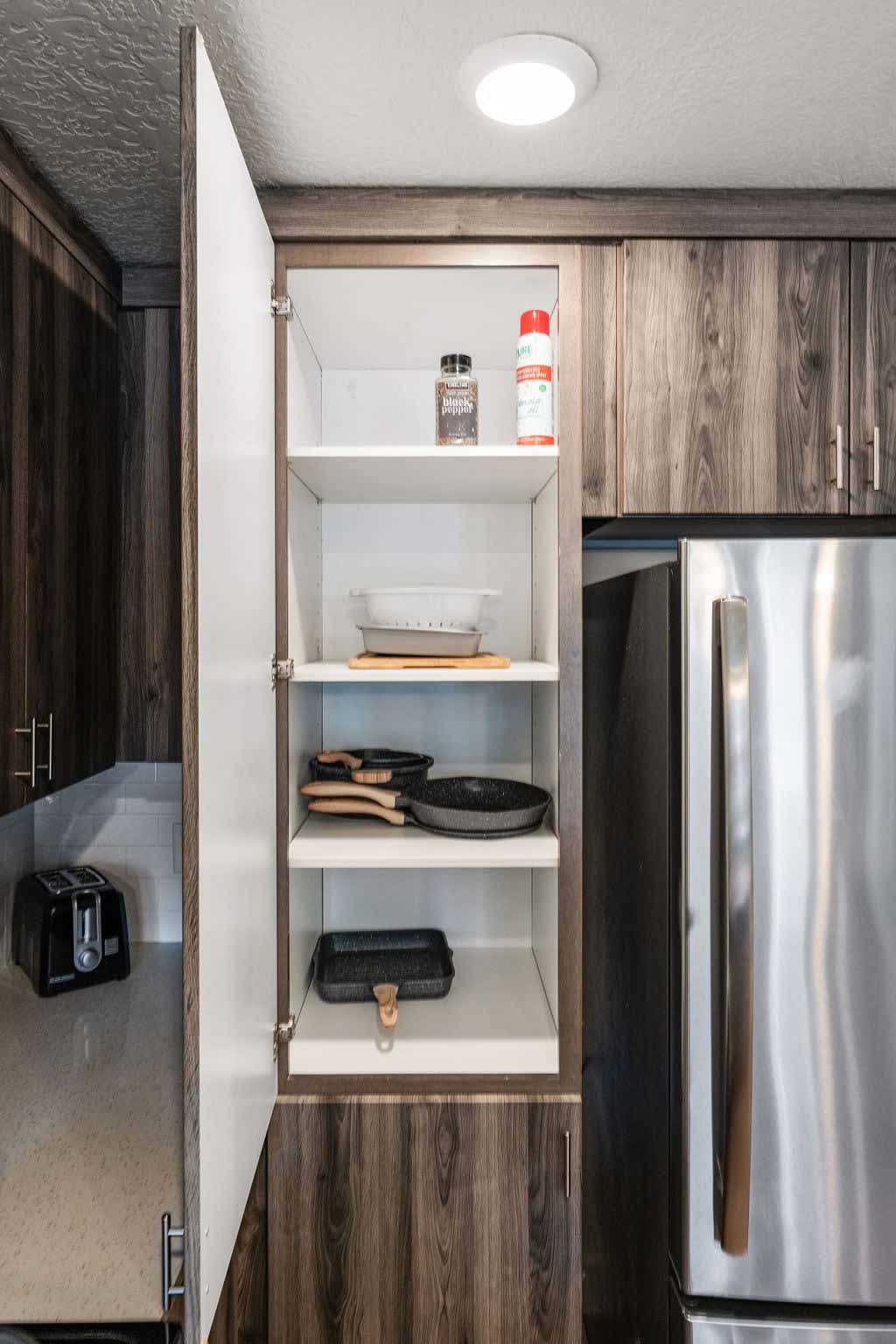 Enjoy the perfect blend of nature and convenience in our kitchen, with a green plant, dishwasher, and all the utensils you need.