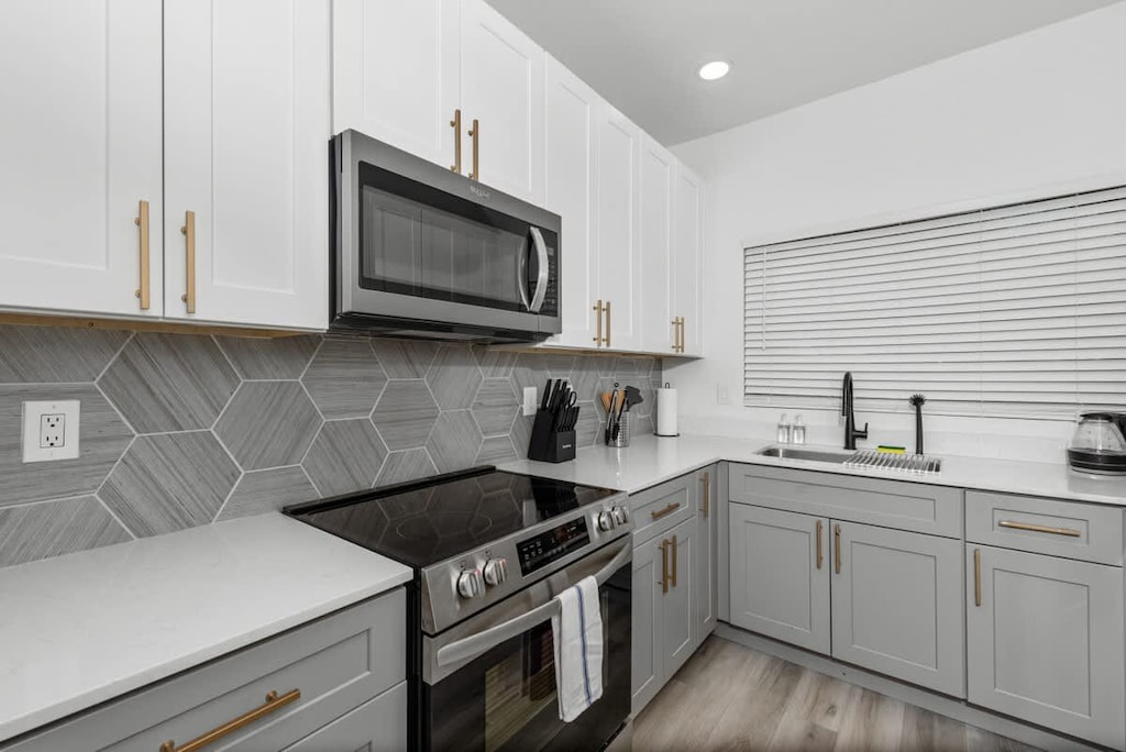 Functional kitchen with oven, stove, fridge and basic cooking ware