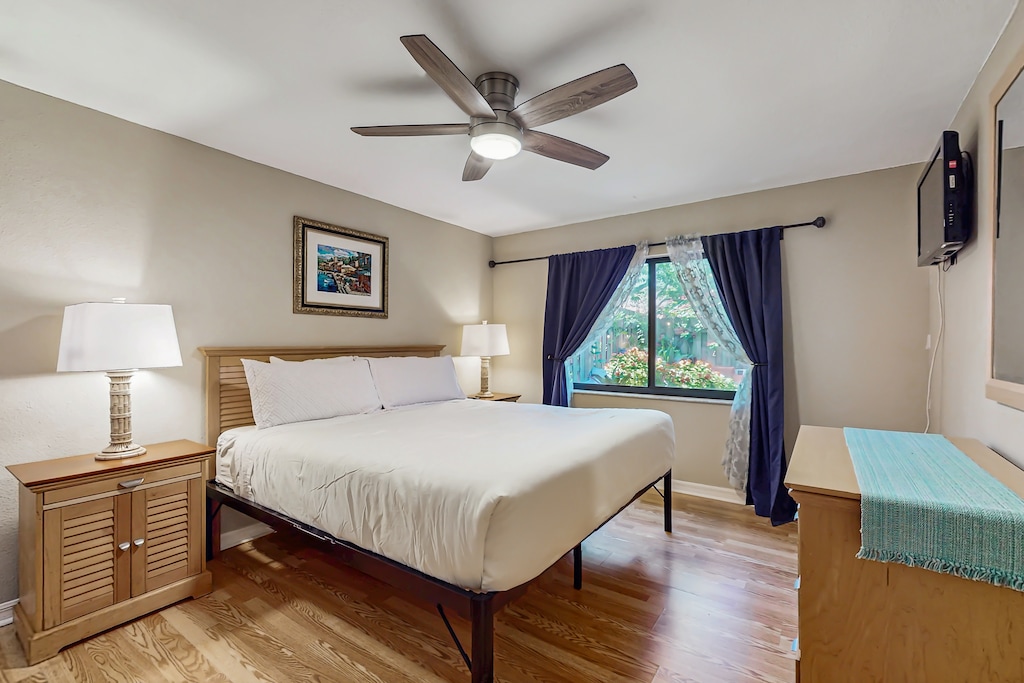 Master bedroom features a large king bed