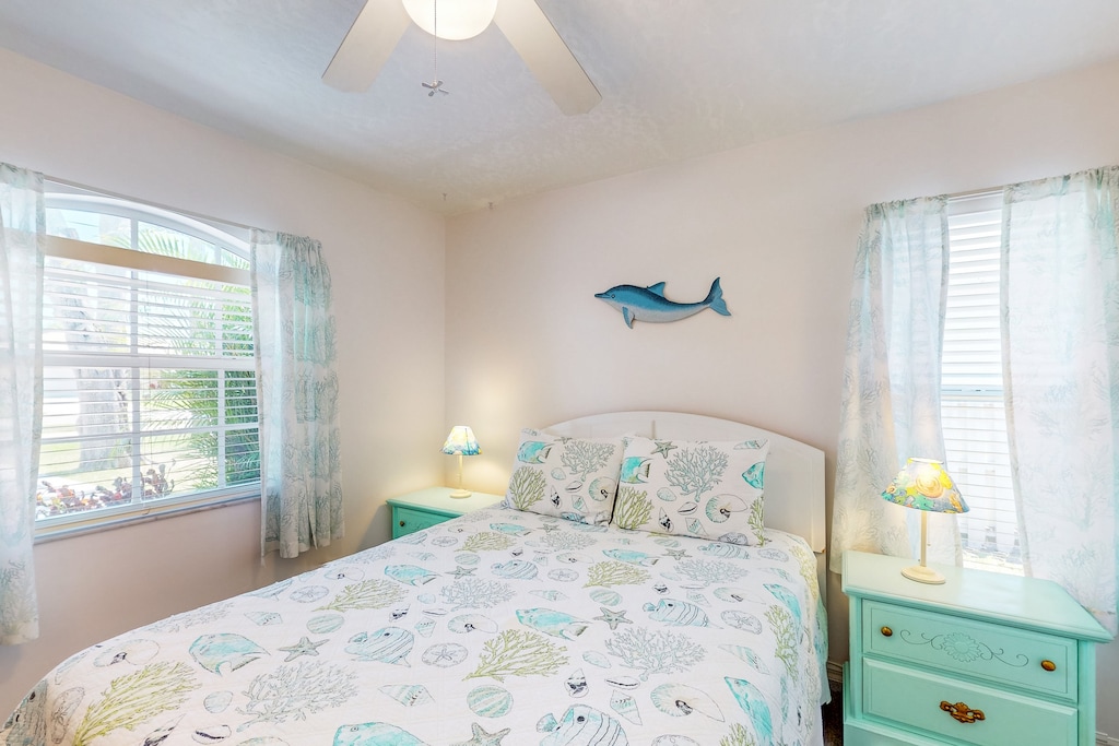 Guest bedroom 1 features a plush queen bed