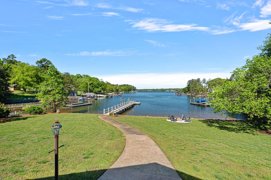 Back yard with fire pit and dock.
