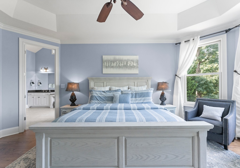 Main Level Primary Suite with deck access and fireplace.