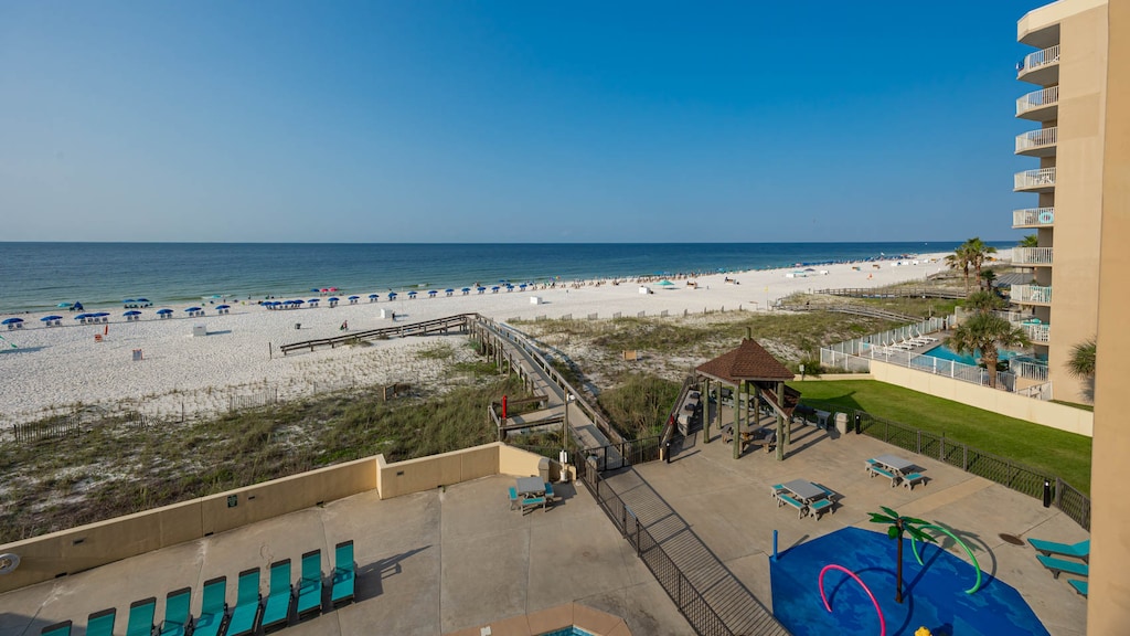 Experience breathtaking views from the larger balcony overlooking the pristine beach, perfect for relaxation and fun