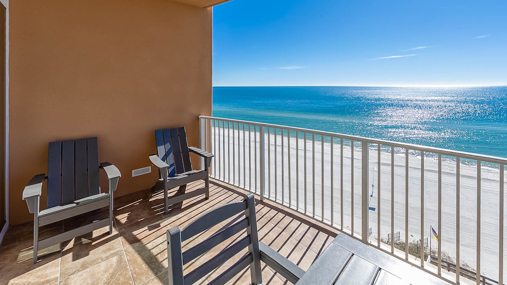 Relax on your private oceanfront balcony with comfortable seating while enjoying endless views of pristine beach and sparkling turquoise waters.