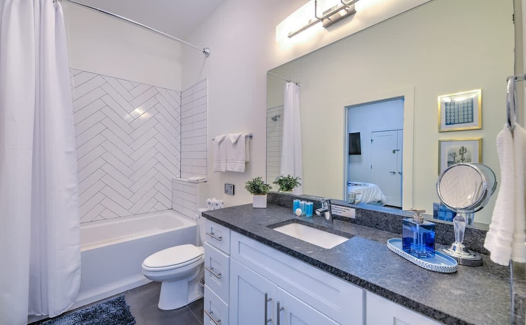 Bright space with chic tile, stylish fixtures, and fresh towels await your retreat!