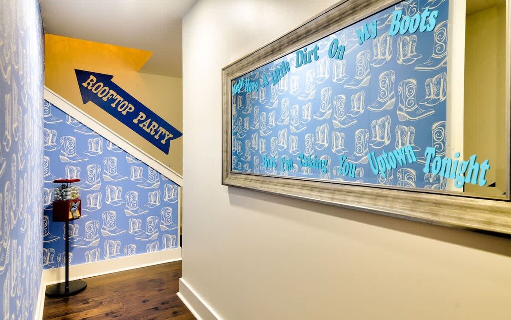 Step into fun with cowboy-themed decor leading to the rooftop party!