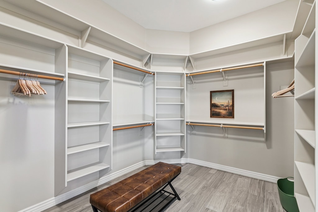 Your spacious walk-in closet offers abundant storage with custom shelving and hanging space for all your belongings.