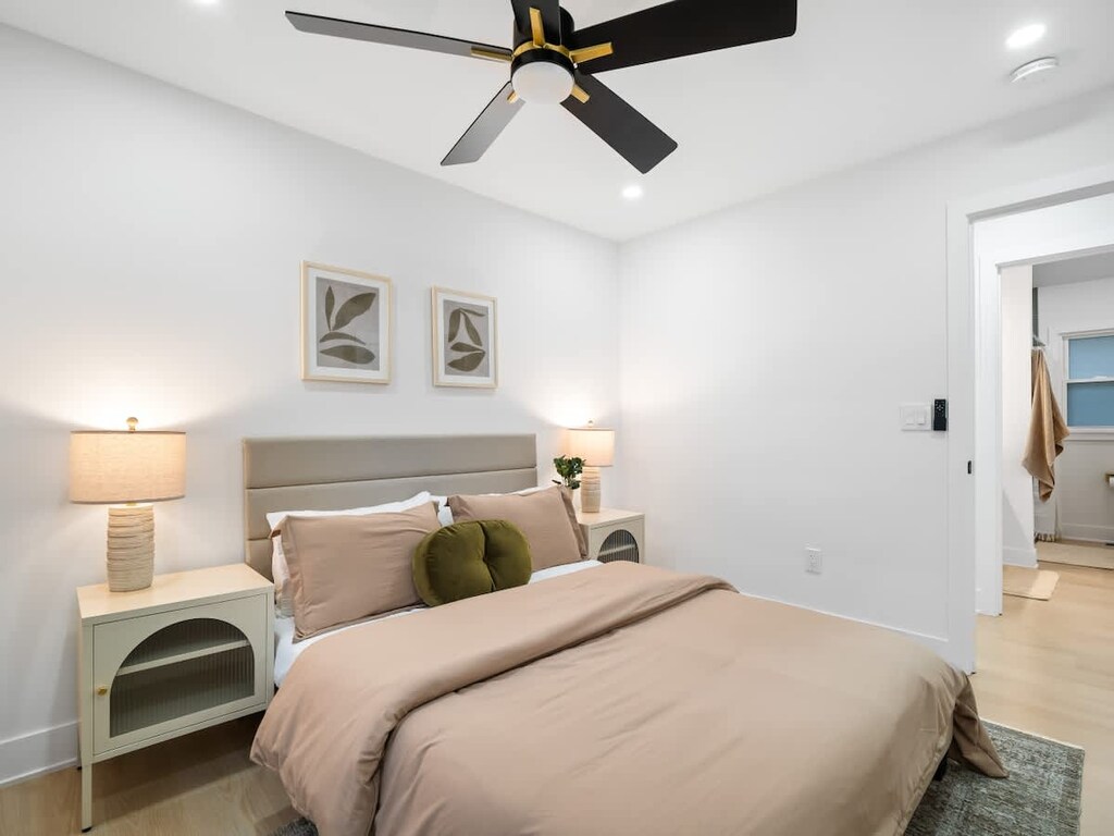 Soft lighting, calming colors, and a comfy bed—perfection!  This space is a total mood booster.