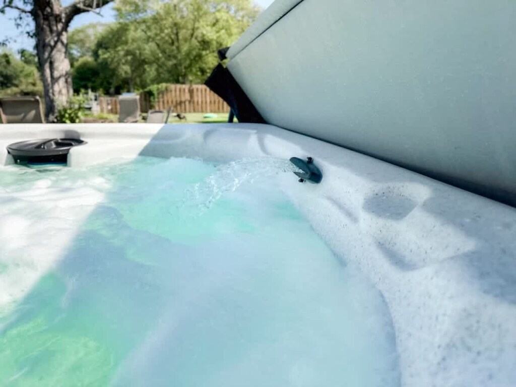 - Bubbling hot tub with jets for total relaxation   - Clear water view and refreshing outdoor breeze   - Comfort and calm with every soak outdoors  
