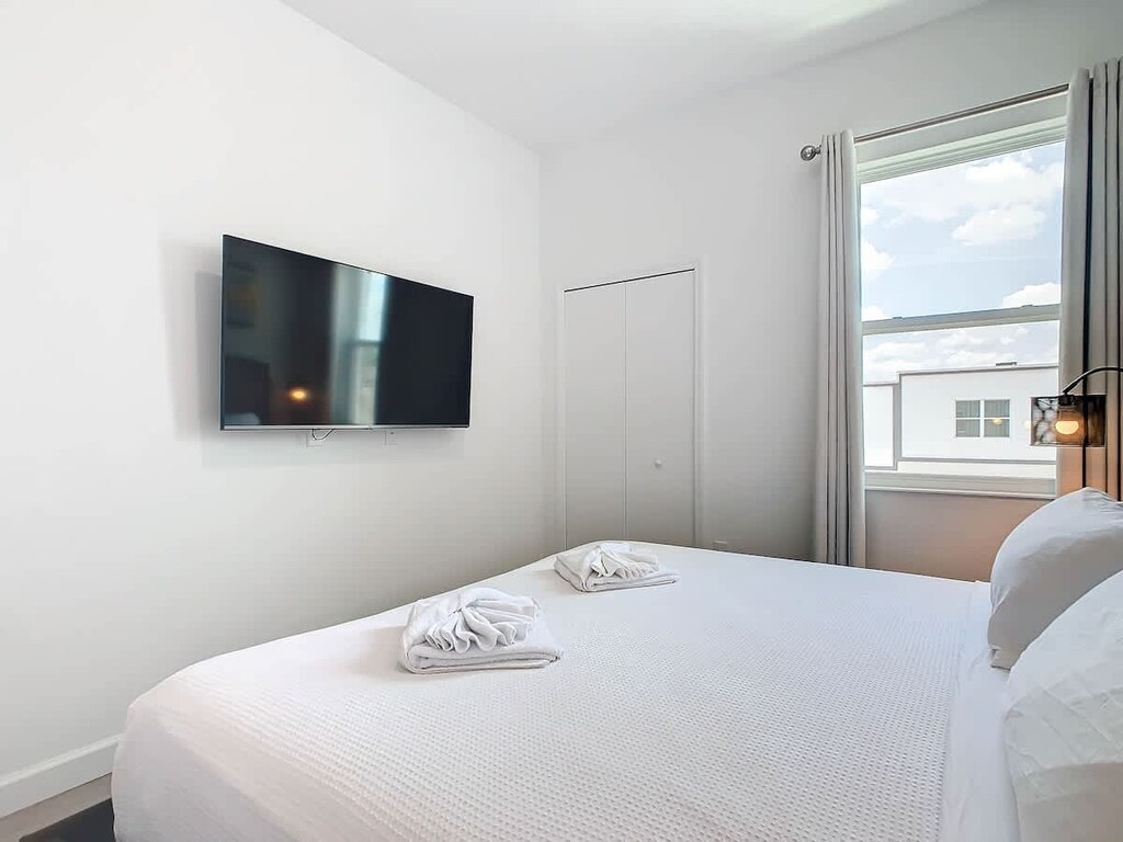 Unwind like royalty in the bedroom featuring a luxurious king-sized bed and a TV.